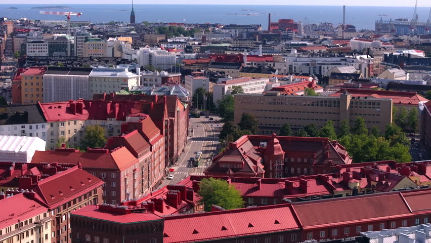 Helsinki, Finland is a beautiful city with a rich history. This aerial view shows the colorful buildings and red roofs of the city on a sunny summer day