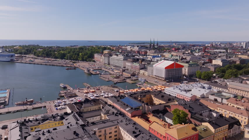 Helsinki, Finland, shines on a bright summer day in this aerial view of the Market Square bustling with tourists and locals