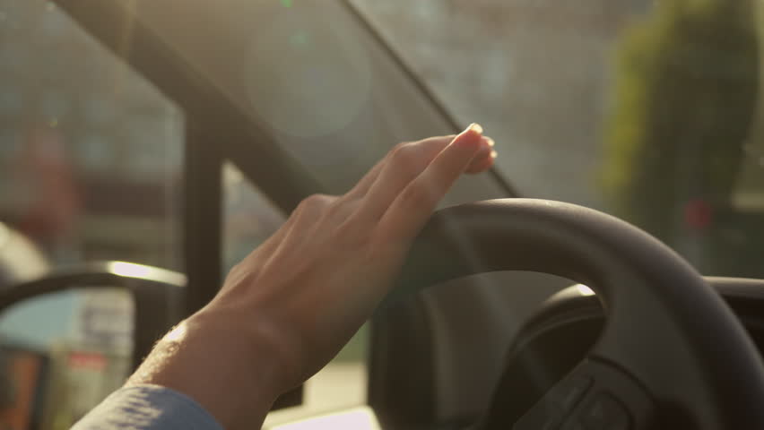 Close up female hands driver turning steering wheel auto destination car driving on parking lot unrecognizable woman girl businesswoman drive luxury automobile city travel rent buy vehicle transport