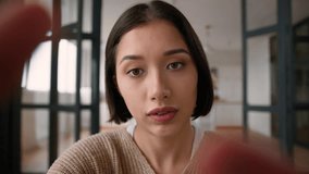 POV webcam point of view angry annoyed Latina woman girl Caucasian female user influencer social media addict mobile phone typing message touch screen cellphone displeased lady online chatting at home - Powered by Shutterstock - Get 15% off with code: PIKWIZARD15