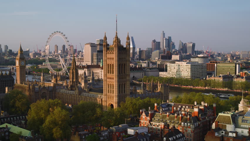 Aerial View Shot of London UK, United Kingdom, sunset, Westminster, Big Ben, grand light