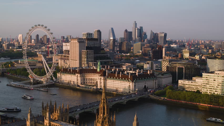 Aerial View Shot of London UK, United Kingdom, sunset, Westminster, Big Ben, grand light