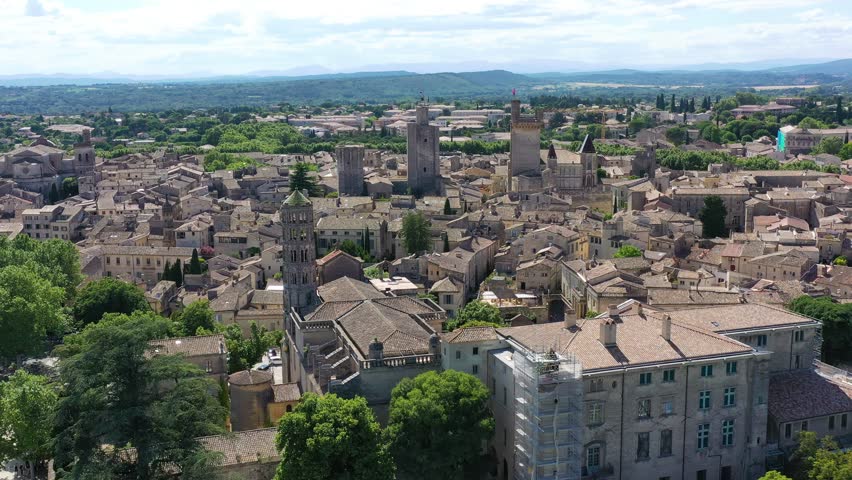 View of beautiful town of Uzes, Gard department, France. Aerial view of the historic town of Uzes, France. Historic town of Uzes with stunning aerial views of its medieval architecture, Gard, France.