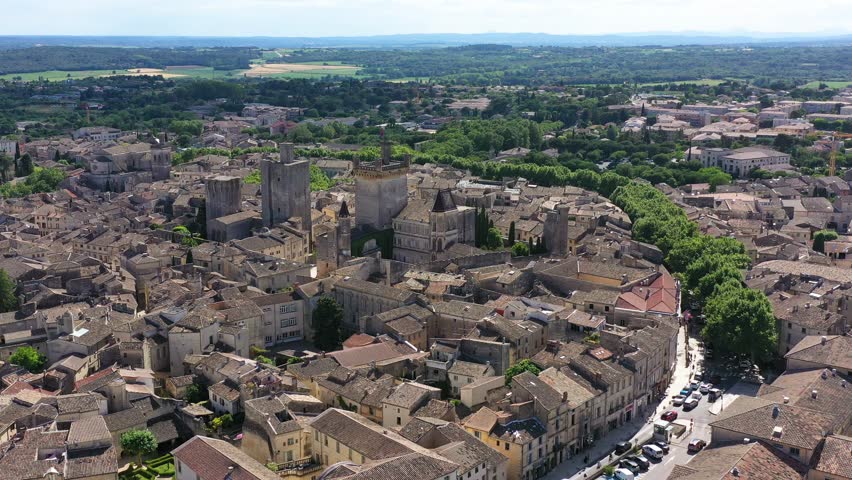 View of beautiful town of Uzes, Gard department, France. Aerial view of the historic town of Uzes, France. Historic town of Uzes with stunning aerial views of its medieval architecture, Gard, France.
