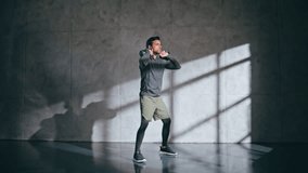 Strong bodybuilder lifting kettlebell making squat in gym. Healthy man training with weight enjoying hard workout. Fitness guy holding heavy equipment for muscle power. Bodybuilding and weightlifting  - Powered by Shutterstock - Get 15% off with code: PIKWIZARD15