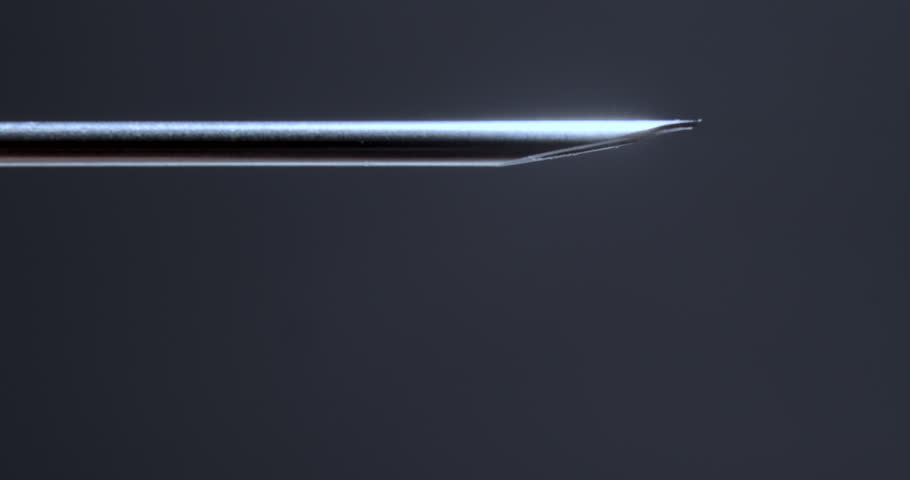 Syringe Needle Dripping in Stylized Low Key Lighting