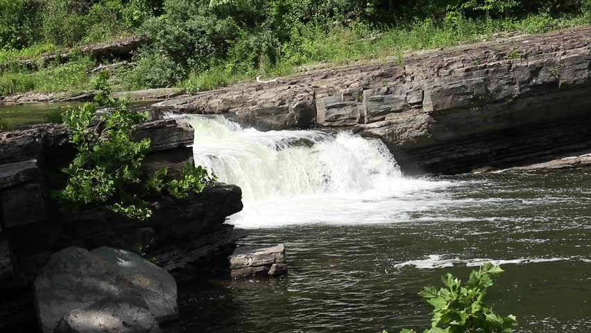 water flowing over small waterfall in high falls new york near rosendale (hudson valley river rondout creek) hydroelectric plant slanted rocks glacial gorge slate