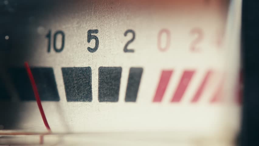 Retro sound level meter decibel meter in studio, vintage audio equipment, close up magnetic tape music player amplifier.