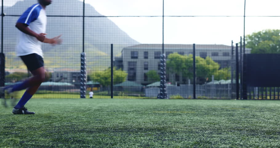 Sports team, running and training as soccer player or athlete for practice or warm up in field. Group of people, outdoor and challenge for match or football game with workout, fitness and exercise