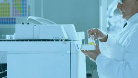 Animation of network of medical icons over caucasian male scientist working at laboratory. Connection, science, medical research, digital interface and communication, digitally generated video. - Powered by Shutterstock - Get 15% off with code: PIKWIZARD15