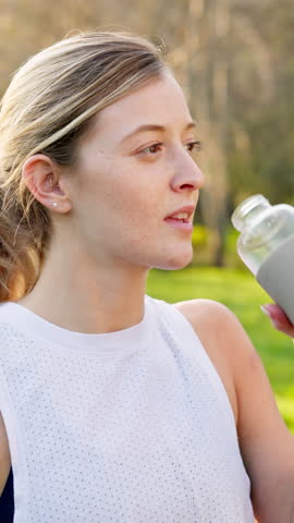 Woman, drinking water and hydration in walking, running or fitness for wellness exercise as athlete. Female person, health and outdoor sport with, detox, rest and break in activity, workout or nature