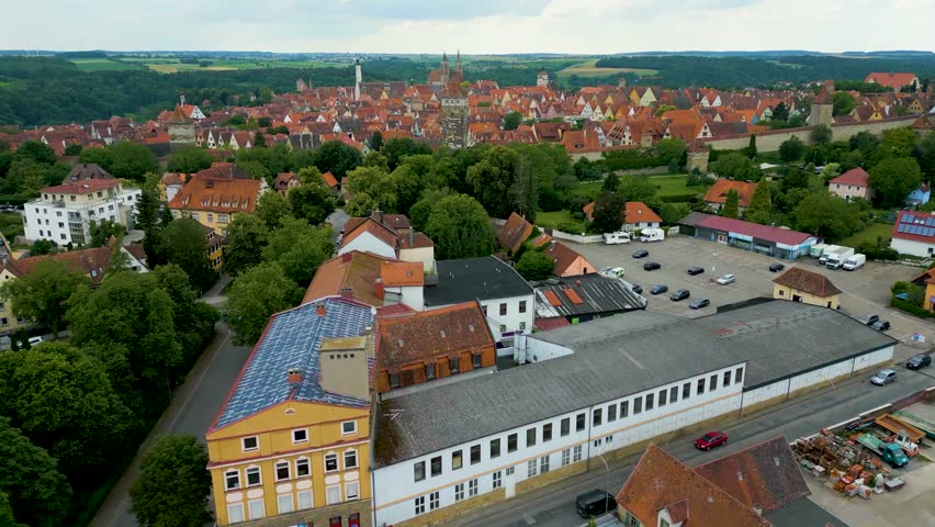4K Aerial Drone Video of the Röderturm Tower and Turm und Stadtmauerweg Park Outside the Gate of the Walled City of Rothenburg ob der Tauber, Germany