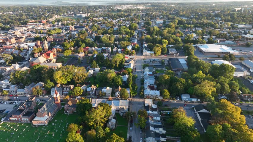Aerial view of Carlisle, Pennsylvania, featuring a mix of historic buildings, residential areas, and tree-lined streets on a clear day.
