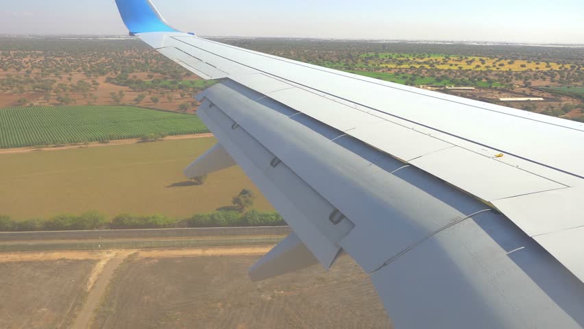 Time lapse of an airplane wing during takeoff in Agadir, Morocco, capturing the flaps' motion in 4k