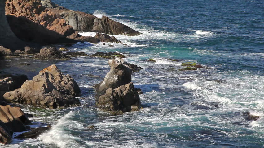Sea waves against the rocky beach.