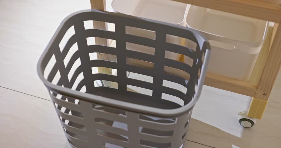 Dirty towel in the plastic laundry basket 