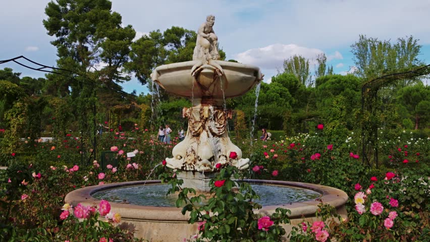 Retiro park in Madrid, fountain in the rose garden in Retiro park in Madrid, capital of Spain, European gardening style, classical architecture