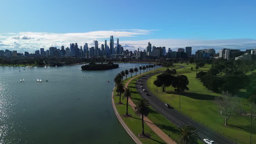 Drone flying above trees between Albert Park lake and golf course in Melbourne