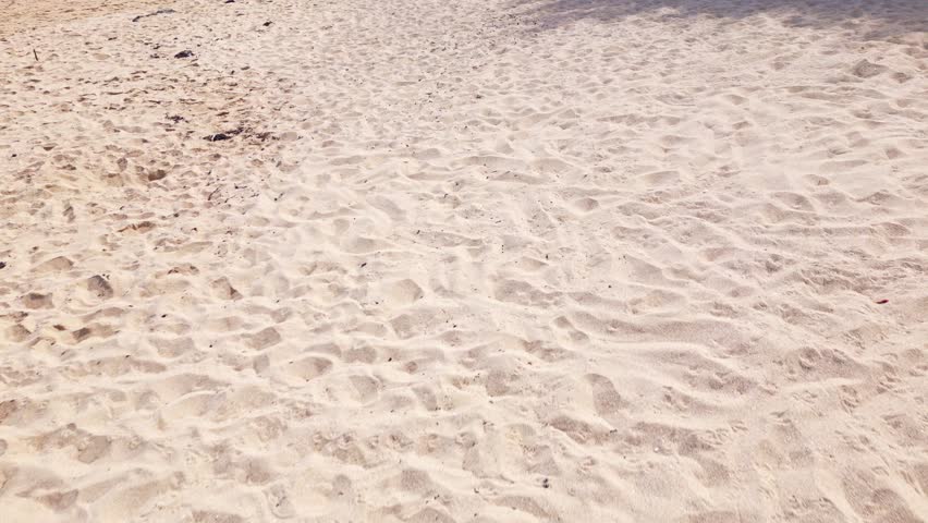 Dramatic smooth movement towards a beach rocks in sandy plage, Bretagne, France.