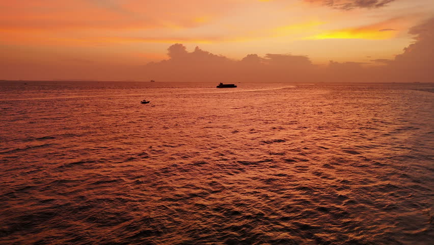4k Colorful sunset at the sea. Romantic Sunet go down, blue and orange clouds flow in sky. Majestic summer landscape. Beautiful sky fluffy clouds evening day	