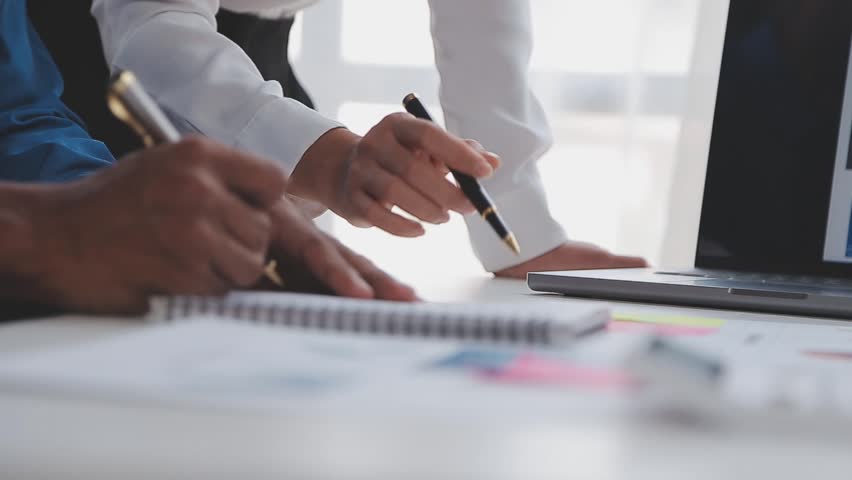 Corporate Financial Analysts Reviewing Business Reports on Digital Tablets During a Team Meeting, Planning Investment Projects and Collaborating on the Successful Execution of Their Financial