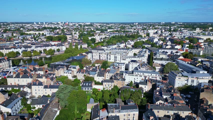 Smooth panning aerial movement about Nantes downtown with buildings, Nantes, France.