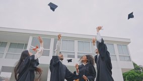 Group of diverse students celebrating college achievement outside campus. Excited graduate man and woman friend wearing graduation gowns and caps outdoors, congratulate each other in university garden - Powered by Shutterstock - Get 15% off with code: PIKWIZARD15