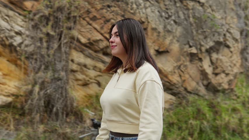 Two friends share a warm embrace in front of a rocky landscape at Las Rocas de Suesca