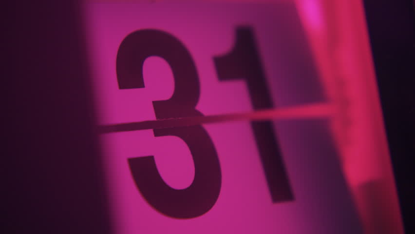 31 days in a month on a flip clock calendar in pink light