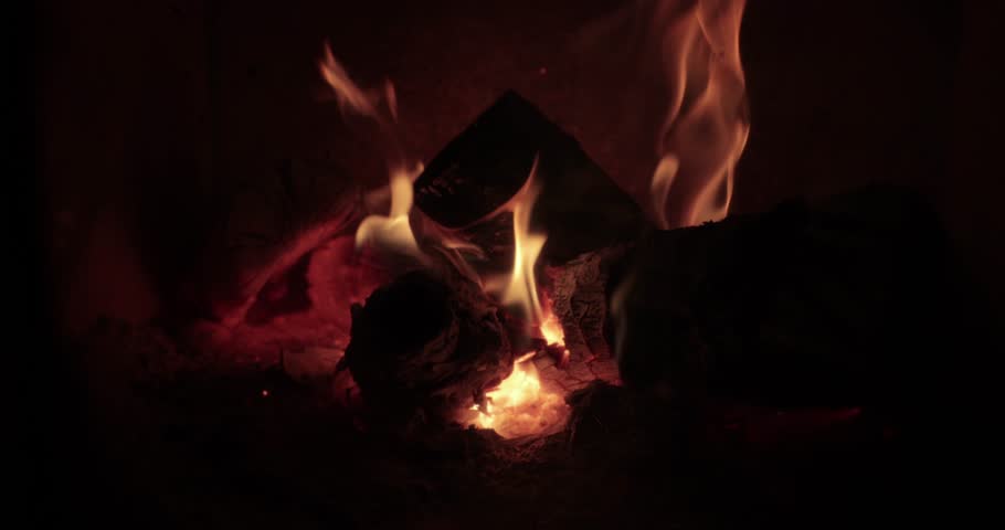 Fireplace, logs on fire calm warm atmophere by the flames