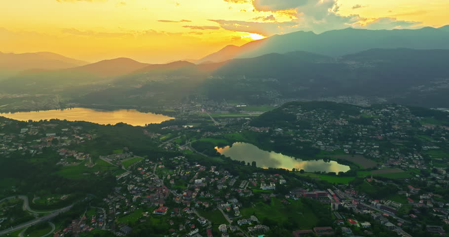 Aerial view of Lugano city and lugano lake from San Salvatore mountain. Aerial footage of the Monte Bre overlooking the city of Lugano in Canton Ticino in Switzerland
