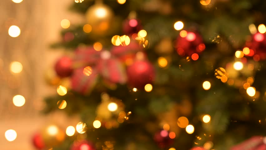 Blurred background footage of christmas decorations, lights. Beautiful decorated room for winter holidays, home celebration setup