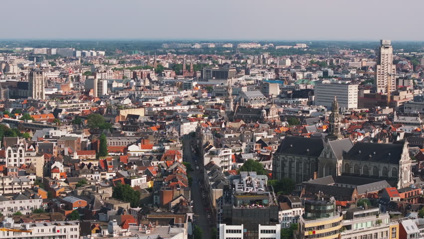 Aerial view of Antwerp, Belgium. The camera pans across the cityscape, showing the density of buildings and streets below