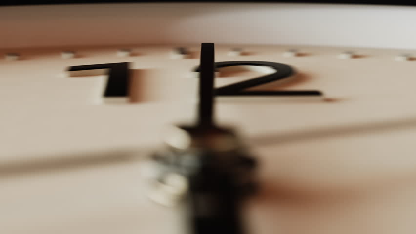 Close-up macro shot time-lapse of black and white classic wall clock, soft sunlight, moving shadows from window blinds, camera locked on moving minute hand