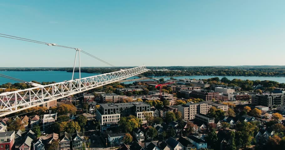 Establishing Drone Dolly In Towards Large Skyscraper Crane Arm in Madison, Wisconsin, Daytime, Cityscape