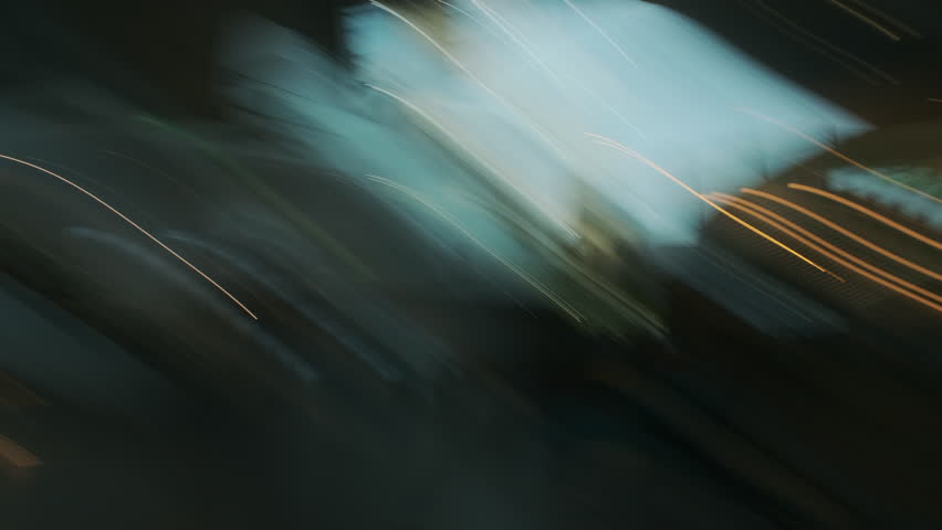 Abstract streaks of light. Slow shutter speed. Multicolored lights in a large room in blur.
