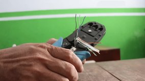 Strip UTP cable for local internet network. Stripping the skin of network cable. - Powered by Shutterstock - Get 15% off with code: PIKWIZARD15