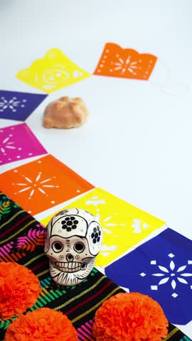 Vertical Video, Day of the Dead backgrounds, white background, hand of a latina woman places a sign with the date November 02