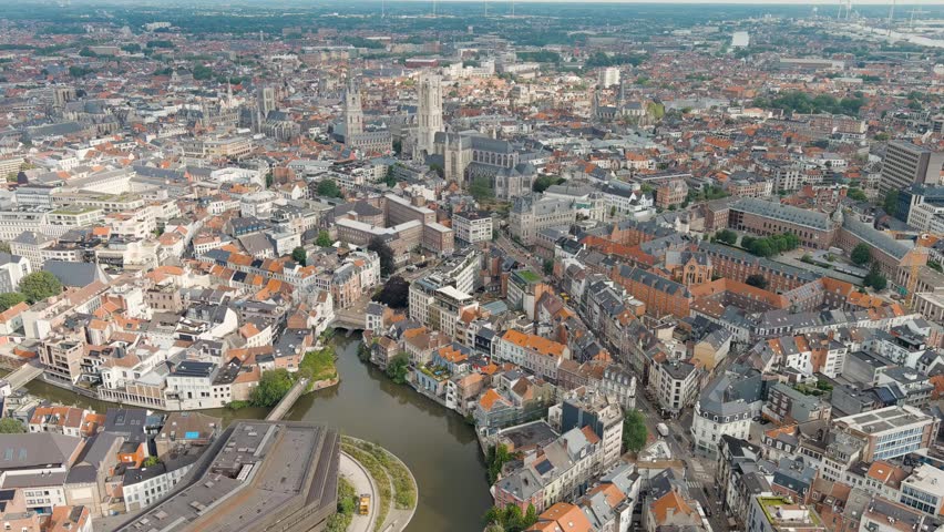 Dolly zoom. Ghent, Belgium. Cathedral of Saint Bavo. Panorama of the central city from the air. Cloudy weather, summer day, Aerial View, Departure of the camera
