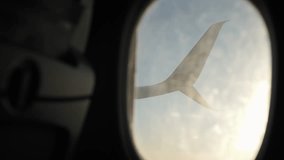Golden sunrise light coming through the window of a commercial airplane window, with lens flare - Powered by Shutterstock - Get 15% off with code: PIKWIZARD15