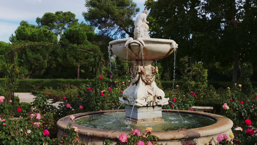 walk in Retiro park in Madrid, fountain in the rose garden in Retiro park in Madrid, capital of Spain, European gardening style, classical architecture. High quality 4k footage