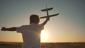 Child run with toy plane nature at sunset. Happy child holds toy plane while run through open field. Kid dream flying with plane. Sunset light shines on child in nature. Child play outdoor toy plane. - Powered by Shutterstock - Get 15% off with code: PIKWIZARD15