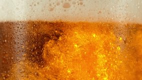 Super slow motion of pouring beer into pint . Filmed on high speed cinema camera, 1000 fps . - Powered by Shutterstock - Get 15% off with code: PIKWIZARD15