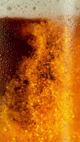 Super slow motion of pouring beer into pint . Filmed on high speed cinema camera, 1000 fps .