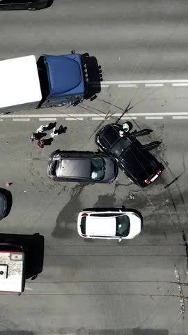 A truck and a car collided on the highway. Serious accident. Traffic accidents on the road. View from above. Traffic jam. Insured event on the road.