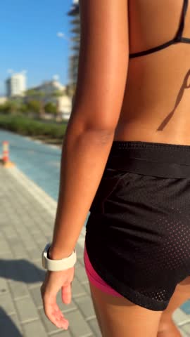 A girl rides after a workout with a sweaty back