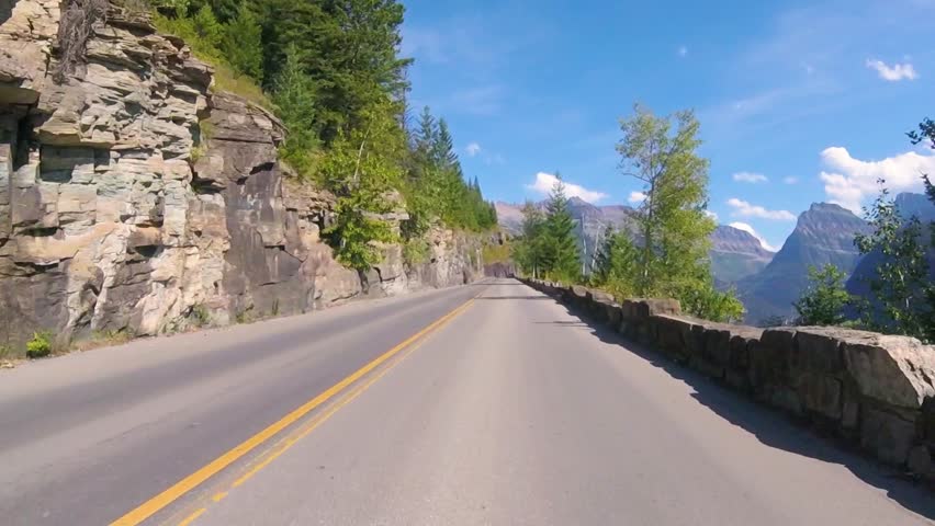 Driving on Going To The Sun Road during summer at Glacier National Park, Montana, USA
