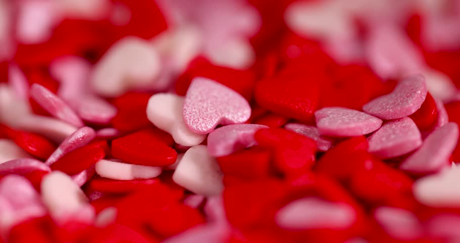 sweet sugar candies in the shape of hearts, red white and pink sugar candies for decoration