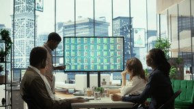 Businessman announces company bankruptcy during a meeting, explains collapse and job losses to worried employees as financial data on the screen reflects economic failure and insolvency. Camera B. - Powered by Shutterstock - Get 15% off with code: PIKWIZARD15