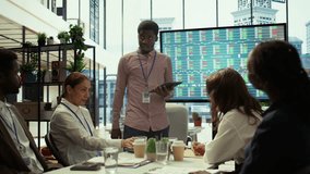 Manager briefs team on corporate collapse revealing bankruptcy and insolvency. CEO presents troubling financial data, signaling the end of the company and loss of jobs for all staff. Camera B. - Powered by Shutterstock - Get 15% off with code: PIKWIZARD15